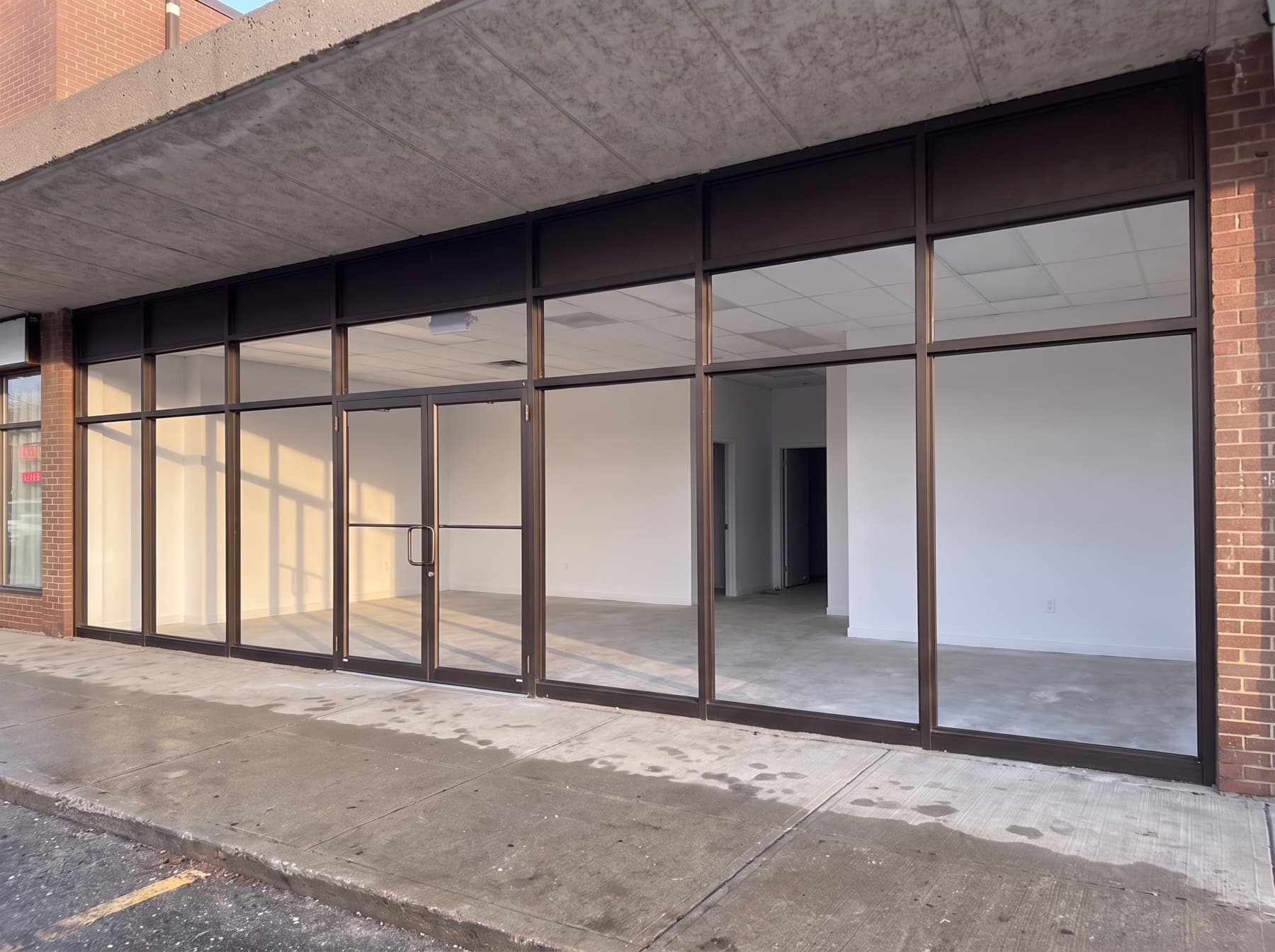Completed aluminum storefront replacement on a Scarborough retail plaza