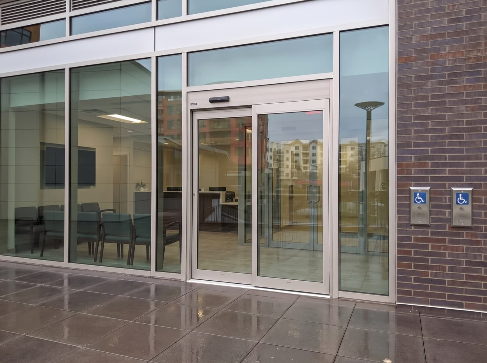 Mississauga clinic-style entrance with aluminum automatic door and AODA accessibility operators